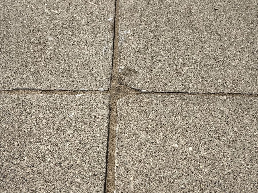 Sealed driveway joint intersection filled flush and clean